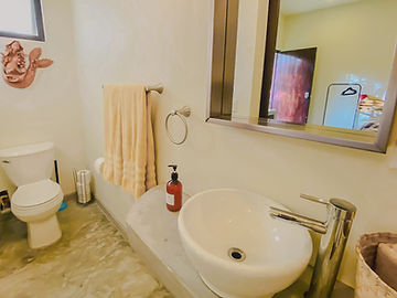 Full bathroom with towels and shelf