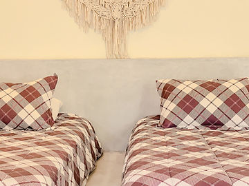 Detail of the beds with plaid textiles