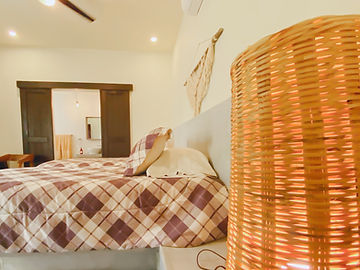 Bed with woven wicker basket